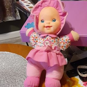 Baby's first doll giggles when you squeeze her.